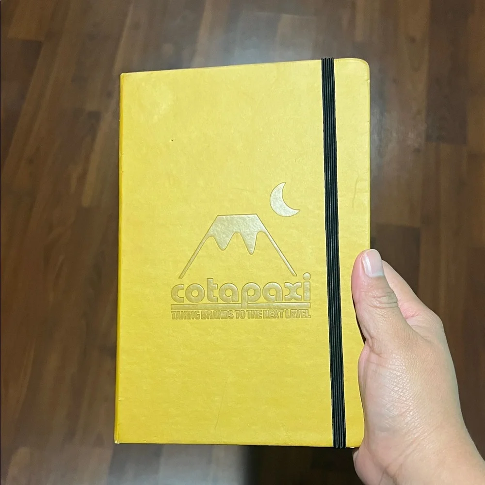 Cotopaxi Yellow Notebook with Black Elastic
